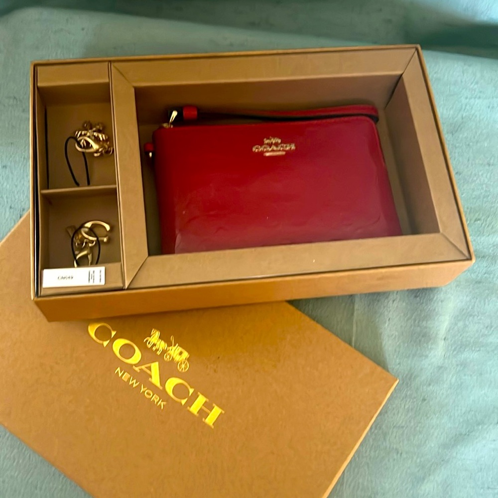 Coach wristlet with extra charms